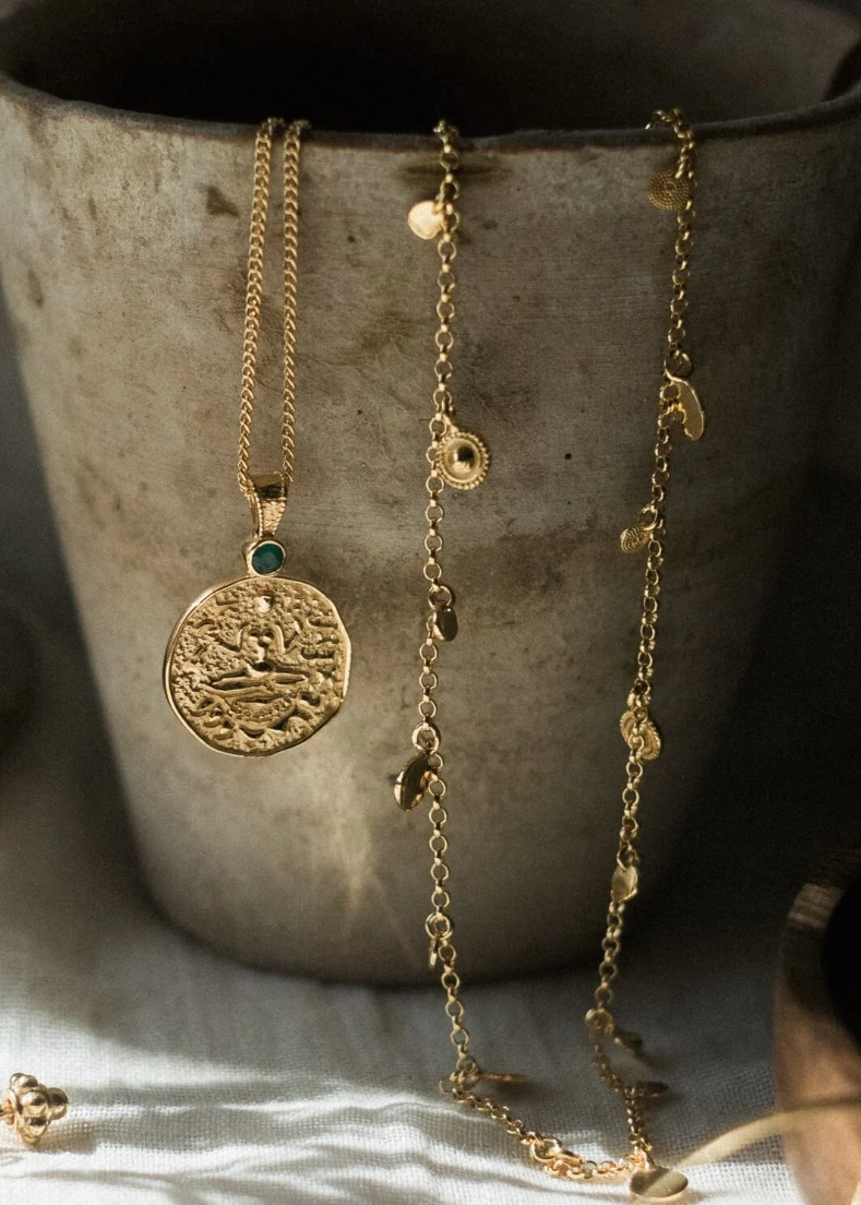 Lakshmi, the radiant goddess of wealth &amp; prosperity, provider of spiritual &amp; material abundance, protector of ill health &amp; adversity, is celebrated in this antique-inspired coin pendant.