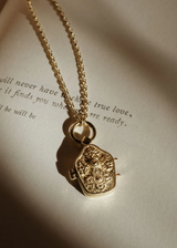 A unique &amp; inspired take on a traditional Tibetan locket. Hanging close to the heart on a chunky rolo chain &amp; inscribed with the secret message&nbsp;'I am safe, divinely guided &amp; protected', this beautiful talisman serves as your daily affirmation.