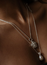 A unique &amp; inspired take on a traditional Tibetan locket. Hanging close to the heart on a chunky rolo chain &amp; inscribed with the secret message&nbsp;'I am safe, divinely guided &amp; protected', this beautiful talisman serves as your daily affirmation.