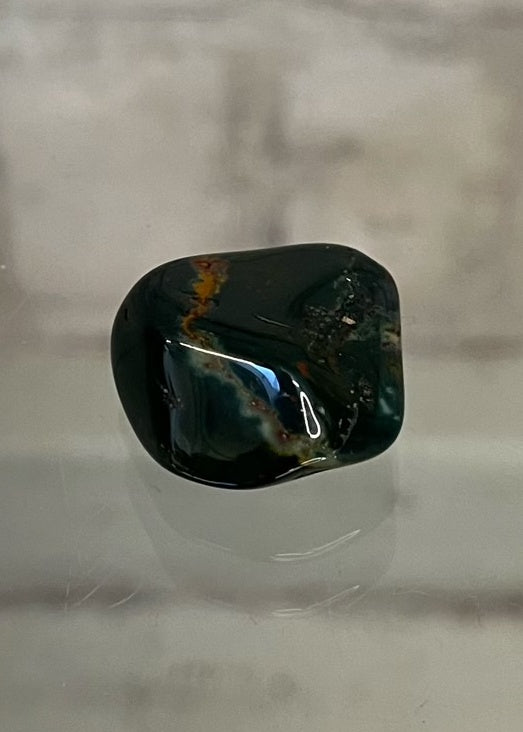 Bloodstone Tumble Stone Crystal  This beautiful stone’s energy carries the purity of blood, encouraging vitality, strength, independence, passion and courage.