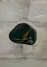 Bloodstone Tumble Stone Crystal  This beautiful stone’s energy carries the purity of blood, encouraging vitality, strength, independence, passion and courage.