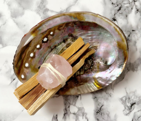 Sacred Palo Santo // Rose Quartz Bundle  3 x Palo Santo, 1 x Rose Quartz  Each bundle has been uniquely hand crafted with the intention to heal, purify and open the heart chakra, whilst respecting and honouring the sacred ancient traditions of Indigenous ritual.  Never leave flame unattended. Always extinguish fully. Each bundle is unique and therefore may vary slightly from photo.