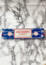 Sacred Incense Sticks // Nag Champa  Magical Properties:  Calms the nervous system and reduces stress, while creating a relaxing ambience for your space,  A wonderful tool to use during meditation, yoga, journaling, manifestation, smudging/purifying ritual and other spiritual ceremonies.   These agarbatti are hand-rolled according to the ancient natural purity masala traditions.  40g pack ca. 30 sticks