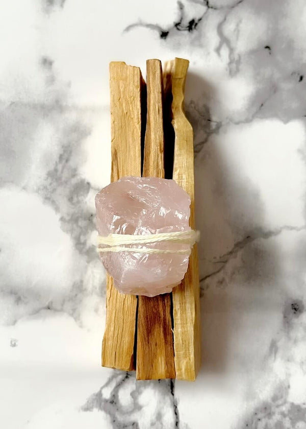 Sacred Palo Santo // Rose Quartz Bundle 3 x Palo Santo, 1 x Rose Quartz Each bundle has been uniquely hand crafted with the intention to heal, purify and open the heart chakra, whilst respecting and honouring the sacred ancient traditions of Indigenous ritual. Never leave flame unattended. Always extinguish fully. Each bundle is unique and therefore may vary slightly from photo.