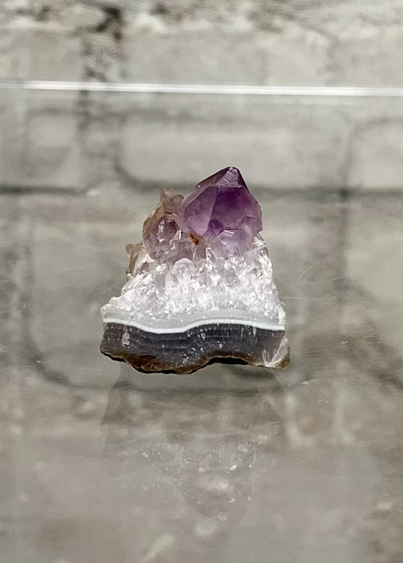 Amethyst Cluster - Magical Properties: Deeply powerful and protective, it brings calm, soothes irritability, alleviates stress and dispels anger. We recommend a monthly charge under the moon to enhance potency.